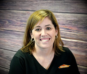 smiling woman against faux fire backdrop