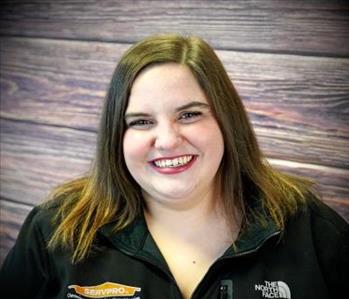 smiling woman against faux fire backdrop