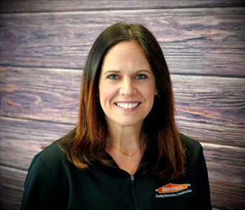 smiling woman against faux fire backdrop